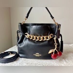 Coach Andy Crossbody bag in black and gold with charm